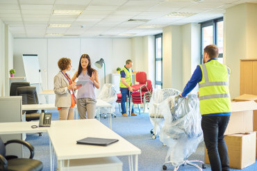 People relocating their business office setting up their IT relocation